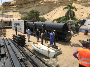 Container with a M1500 being unloaded at Namibe, Angola, ready for assembly.